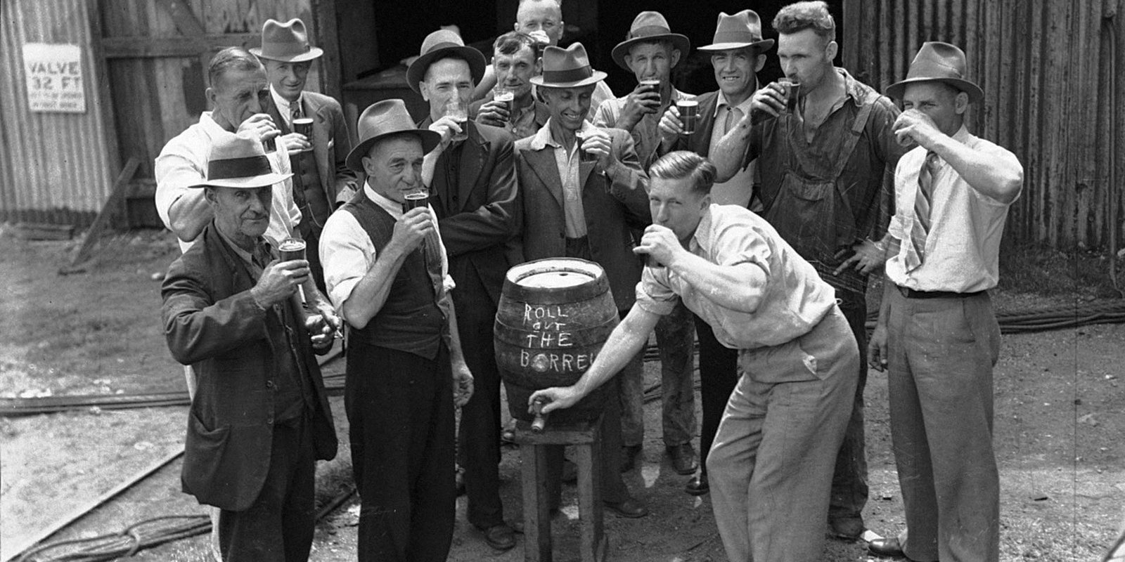 1930's ship builders toasting the launch of a ship
