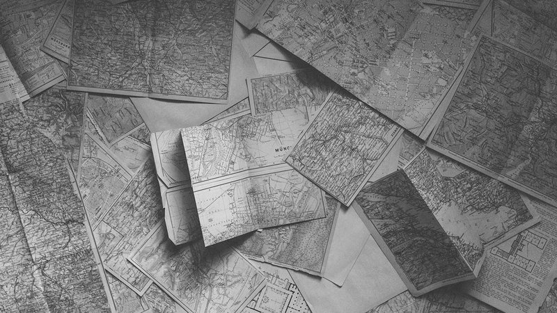 Retro road maps spread out on the floor