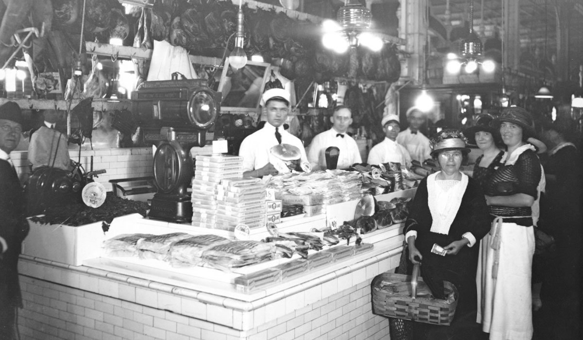 Interior photo of a delicatessen from around the turn of the 19th century